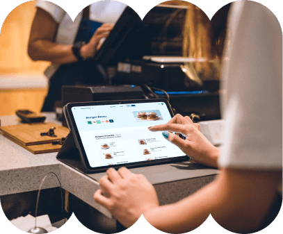 image of female waitstaff at the counter managing their menus on an ipad